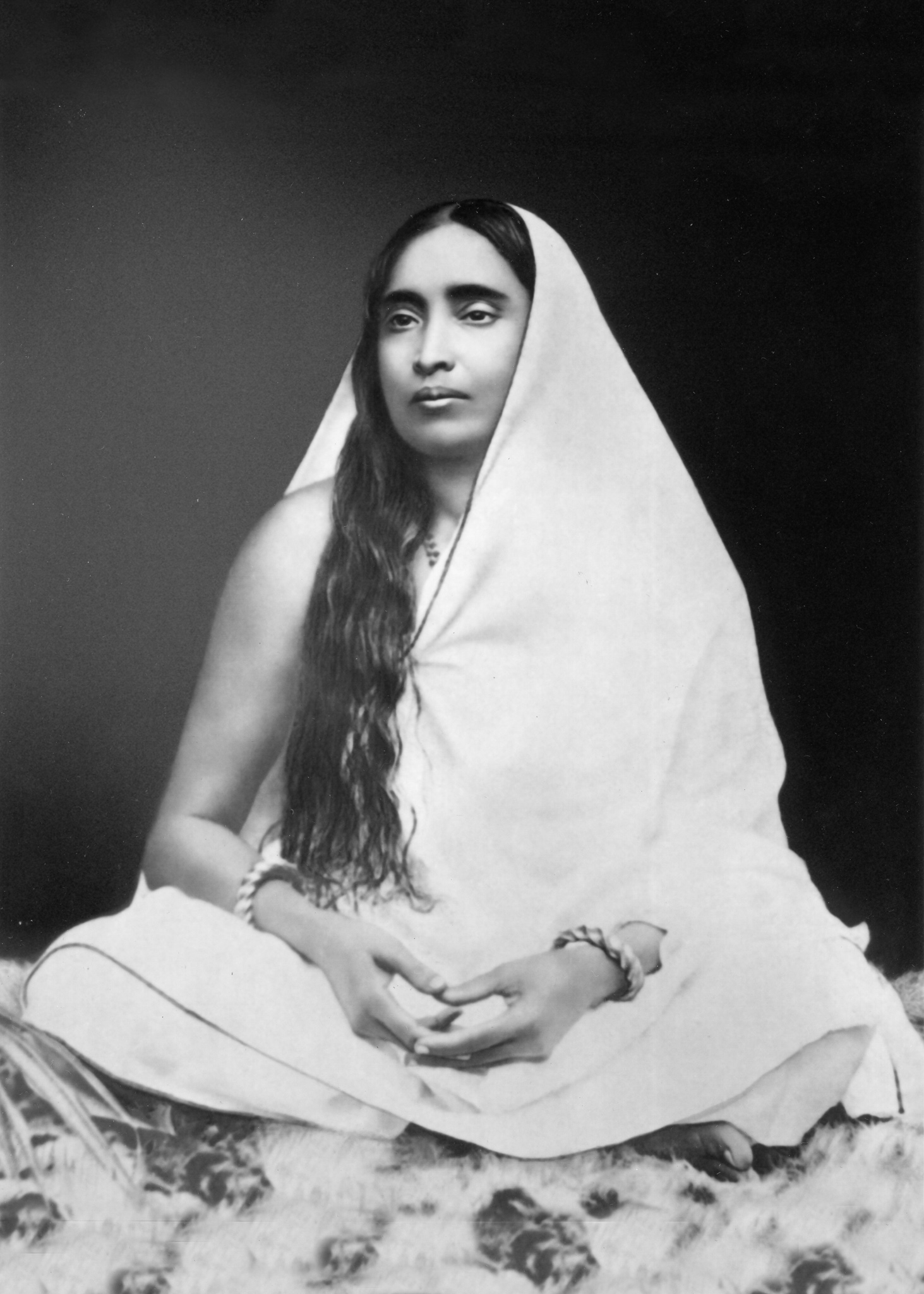 Black and white photo of Sri Sarada Devi seated.