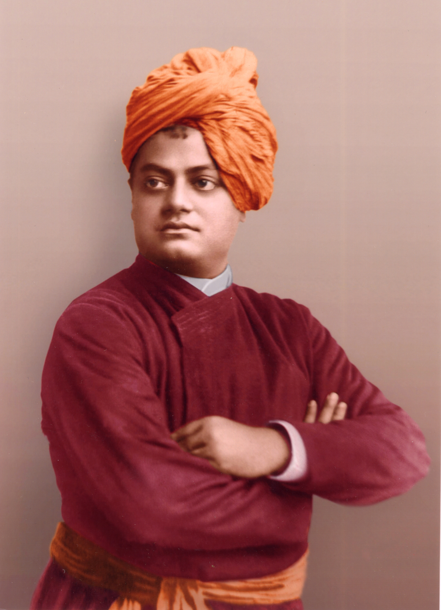 Colored photo of Swami Vivekananda with his arms crossed.